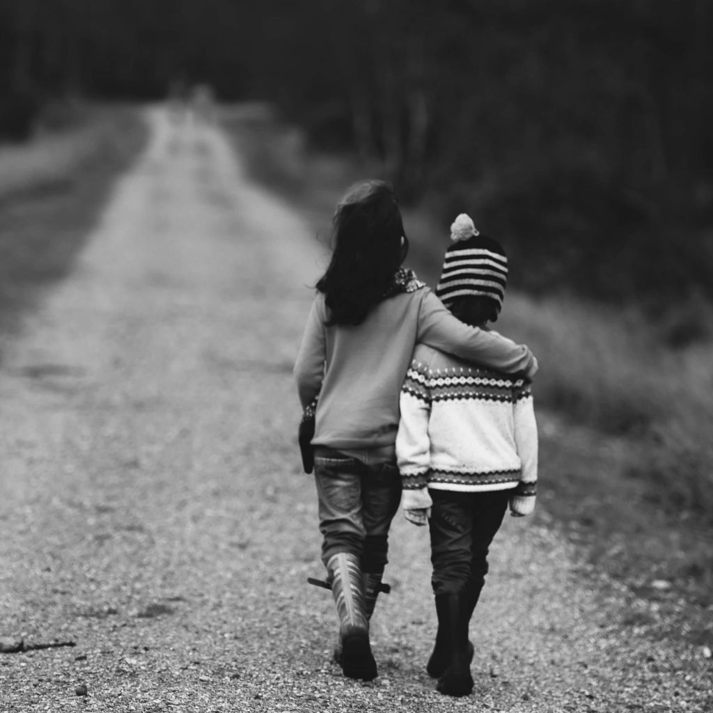 Kids walking down a path